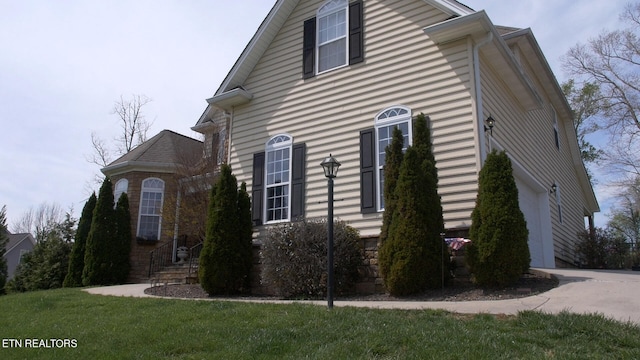 view of home's exterior featuring a lawn