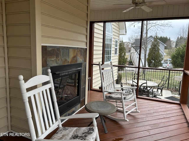 wooden terrace featuring ceiling fan