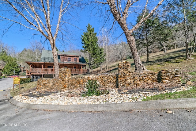 view of front of property with a deck