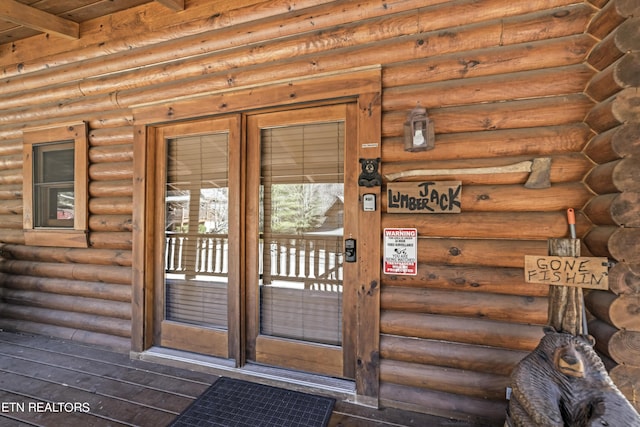 entrance to property featuring log exterior