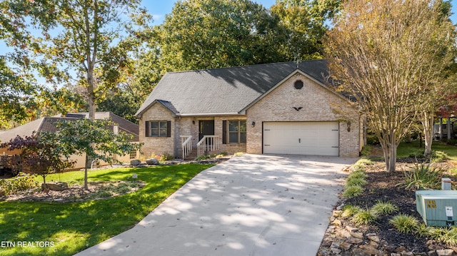 view of front of house featuring a garage and a front lawn