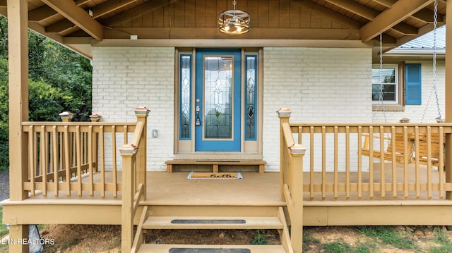 doorway to property with a wooden deck