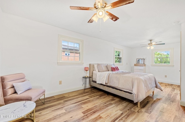 bedroom featuring ceiling fan and light hardwood / wood-style floors