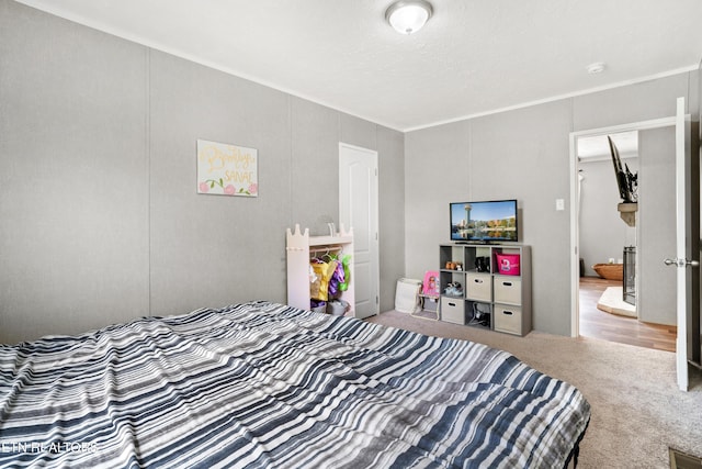 bedroom with carpet floors and visible vents