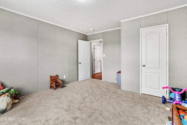 carpeted bedroom featuring a textured ceiling