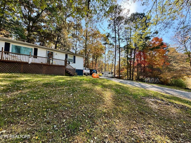 view of yard featuring a wooden deck