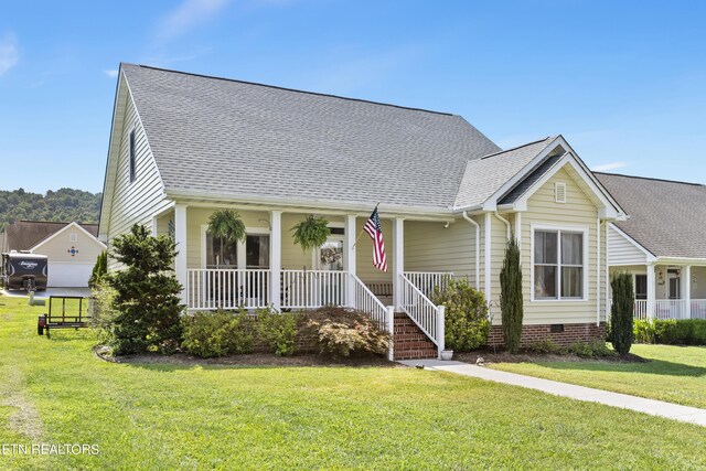 view of front facade with a front yard and a porch