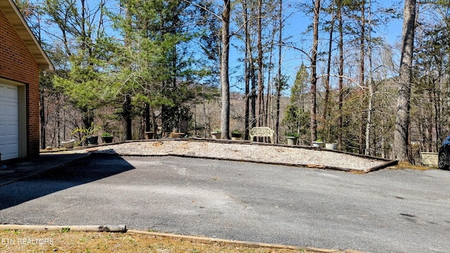 exterior space with driveway and a garage