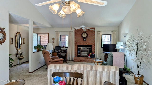 carpeted living area featuring baseboards, lofted ceiling, a fireplace, and a ceiling fan
