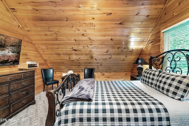 bedroom featuring carpet floors, wood ceiling, wooden walls, and lofted ceiling