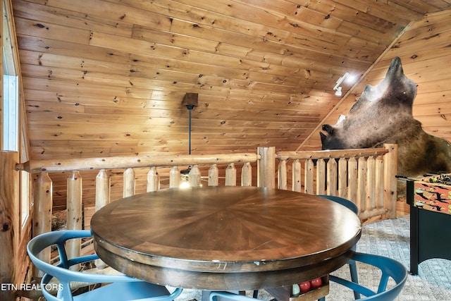 dining area with vaulted ceiling, carpet floors, and wood ceiling