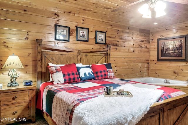 bedroom with ceiling fan, wooden walls, and wooden ceiling