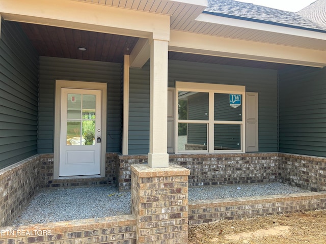 property entrance with covered porch