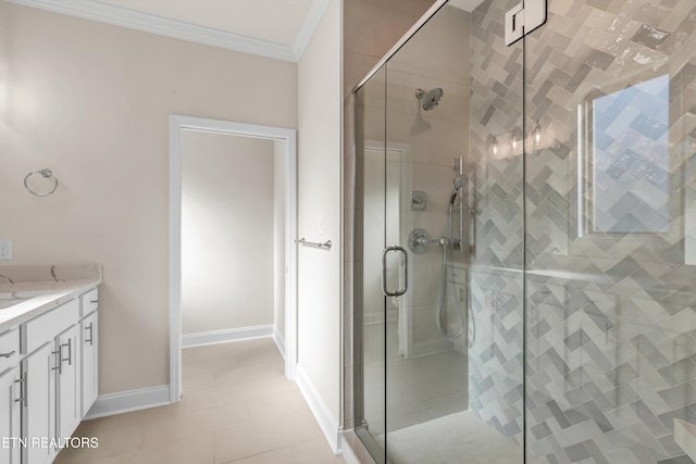 bathroom with ornamental molding, vanity, and a shower with shower door