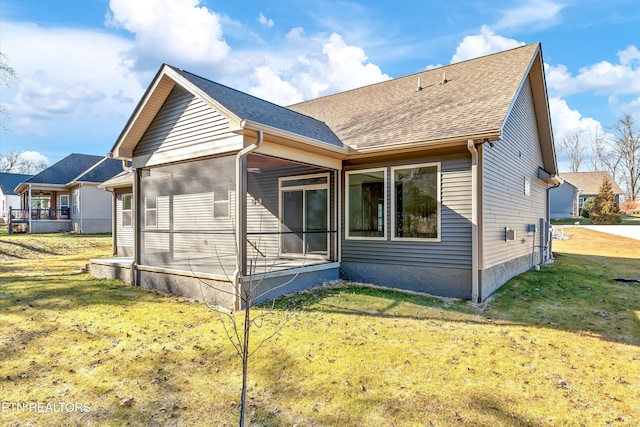 back of property featuring a lawn