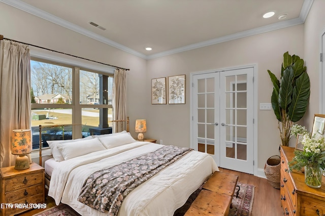 bedroom with recessed lighting, wood finished floors, visible vents, french doors, and crown molding