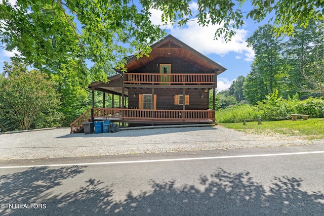 front of property featuring a balcony