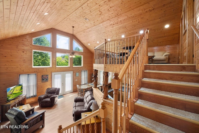 living room with wooden ceiling, hardwood / wood-style flooring, french doors, and high vaulted ceiling