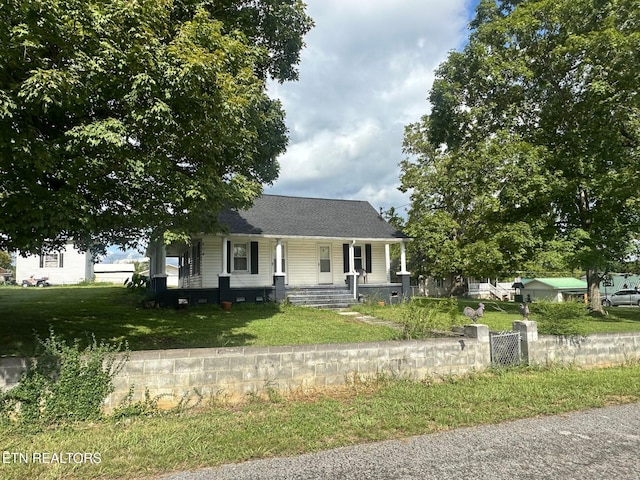 view of front facade with a front lawn and a porch