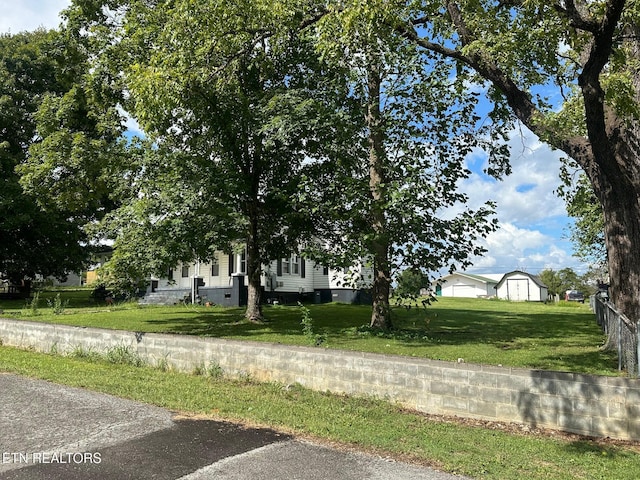 exterior space featuring crawl space and a front lawn