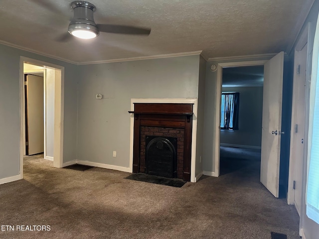 unfurnished living room with carpet floors, crown molding, a fireplace, a textured ceiling, and baseboards