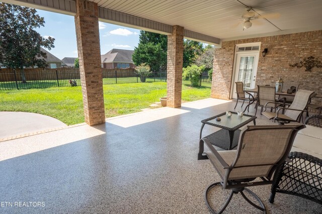 view of patio / terrace featuring ceiling fan