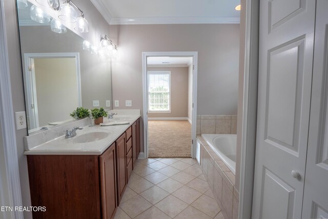 bathroom featuring tiled bath, double vanity, ornamental molding, and tile patterned flooring