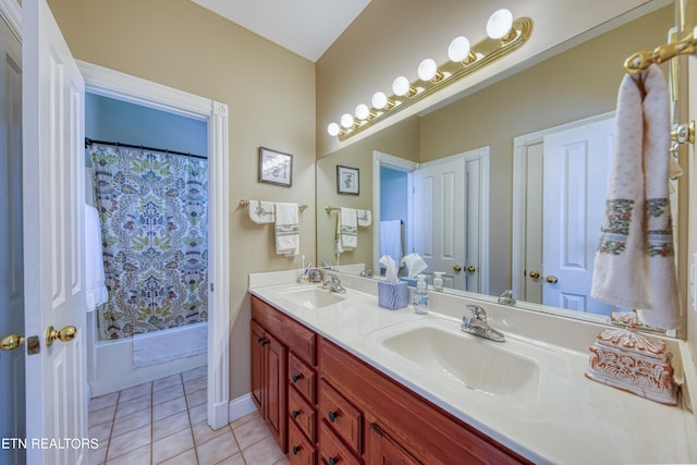 bathroom with shower / tub combo with curtain, tile patterned flooring, and vanity