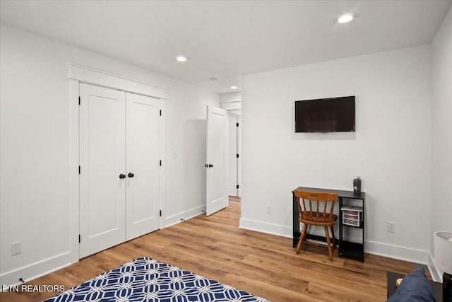 interior space with recessed lighting, baseboards, and wood finished floors