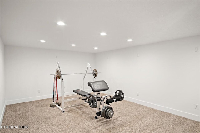 exercise area featuring carpet flooring, recessed lighting, and baseboards