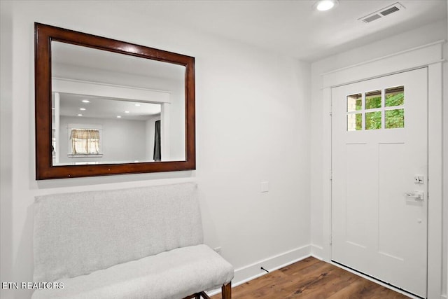 foyer with visible vents, recessed lighting, baseboards, and wood finished floors