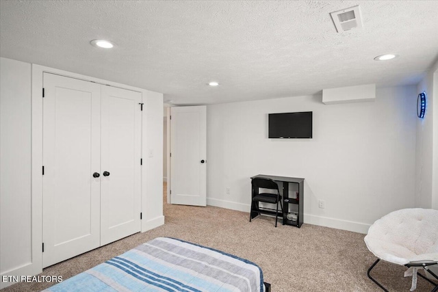 carpeted bedroom with recessed lighting, baseboards, visible vents, and a textured ceiling