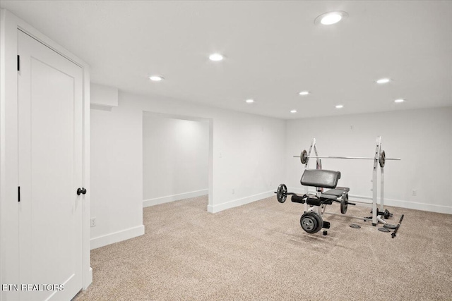 exercise room featuring carpet flooring, recessed lighting, and baseboards