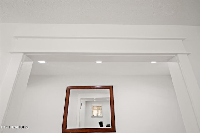 interior details featuring recessed lighting and a textured ceiling