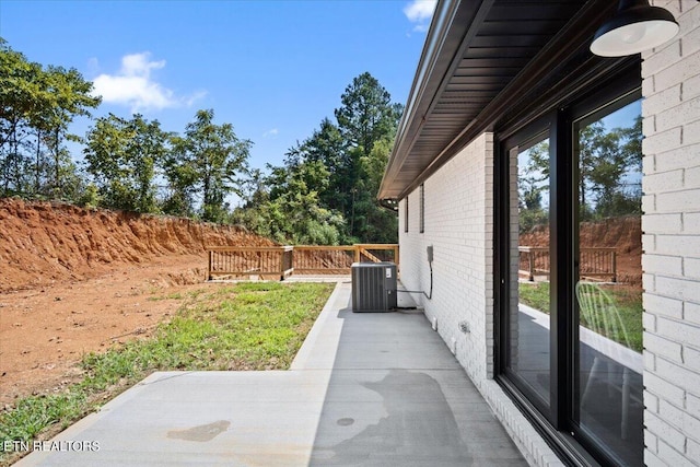 view of patio / terrace with cooling unit and fence