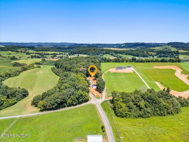 birds eye view of property featuring a rural view