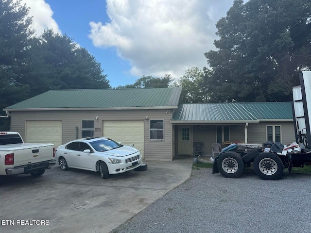 ranch-style home featuring a garage