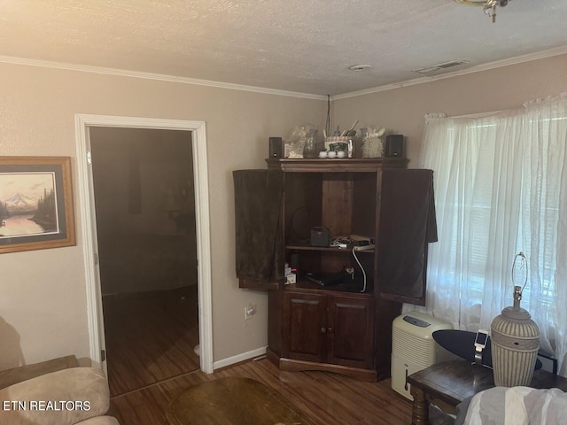 living room featuring a textured ceiling, crown molding, and wood-type flooring