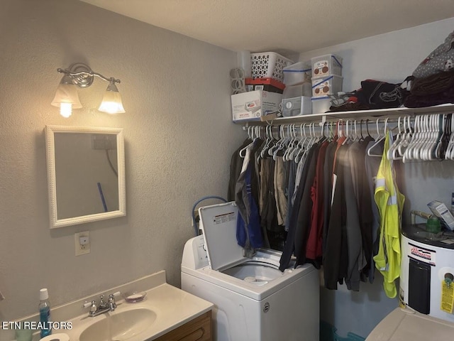 laundry room with sink and washer / clothes dryer