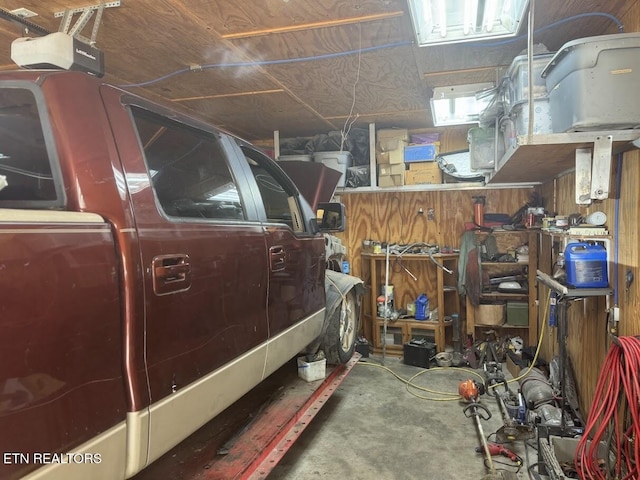 garage featuring a workshop area and a garage door opener