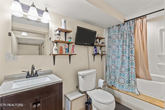 full bathroom with vanity, shower / bath combo with shower curtain, and toilet