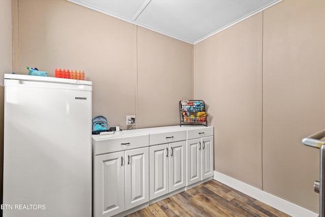 laundry room with wood-type flooring