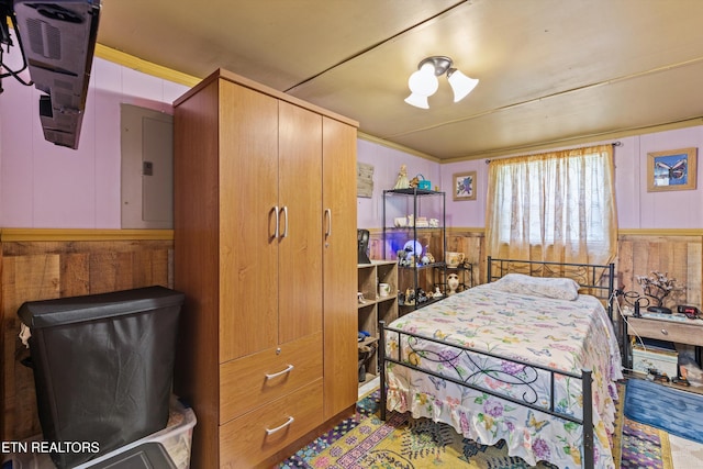 bedroom featuring electric panel