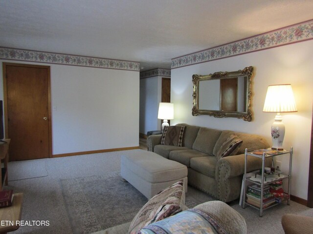 living room with carpet flooring and baseboards