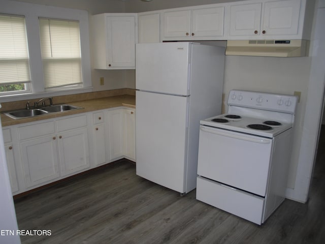 kitchen with sink, white appliances, wall chimney range hood, and dark hardwood / wood-style flooring