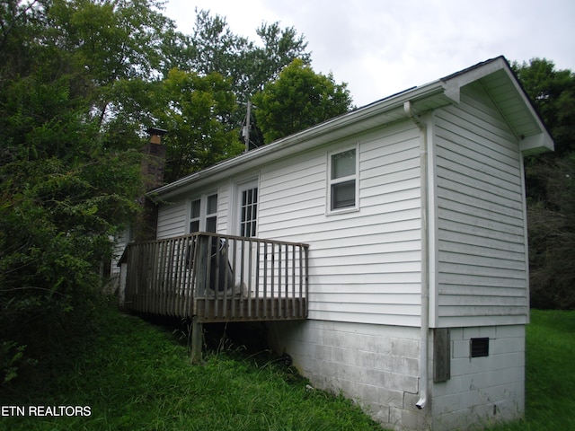 back of house featuring a deck