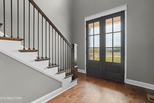 entryway featuring french doors and dark hardwood / wood-style flooring