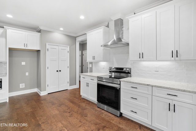 kitchen with white cabinetry, wall chimney range hood, stainless steel electric range oven, and dark hardwood / wood-style flooring