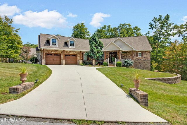 craftsman-style home with a garage and a front lawn