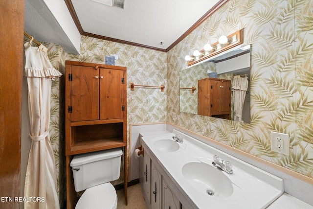 bathroom with dual vanity, toilet, and ornamental molding